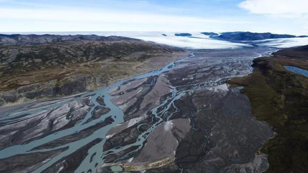 Water and sediment pour off the melting margin of the Greenland ice sheet. Photo: Jason Edwards/Photodisc via Getty Images