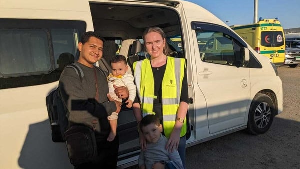 Sara and Ali El Estal with their uncle Mohammed Jendia, pictured with Irish diplomat Grace Earley, after crossing from Gaza