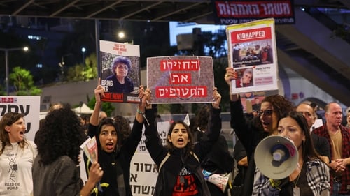 Families of Israeli hostages held in Gaza protest outside the ministry of defence in Tel Aviv